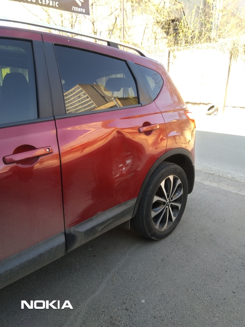 Удаление вмятин на задней двери без покраски на автомобиле Nissan (Ниссан)